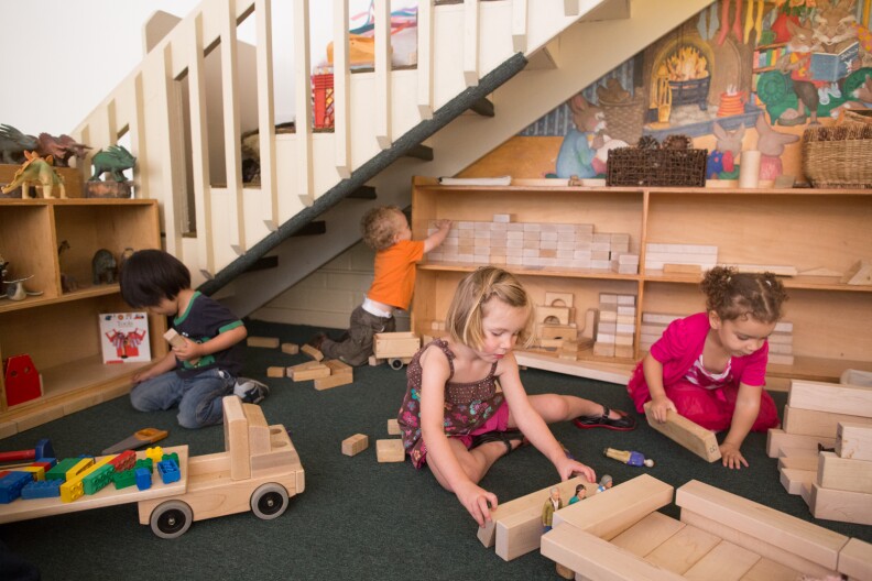 Girls and boys play with blocks at the Child Educational Center in La Cañada.