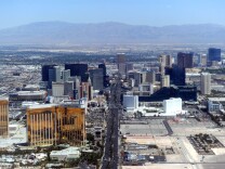 Aerial view of the Las Vegas boulevard, the Strip, in Las Vegas, Nevada on June 10, 2011. The Las Vegas Strip is an approximately 4.2-mile (6.8 km) stretch of Las Vegas Boulevard in Clark County, Nevada, adjacent to, but outside the city limits of Las Vegas proper. Many of the largest hotel, casino and resort properties in the world are located on the Las Vegas Strip. Nineteen of the world's 25 largest hotels by room count are on the Strip, with a total of over 67,000 rooms. AFP PHOTO / GABRIEL BOUYS (Photo credit should read GABRIEL BOUYS/AFP/Getty Images)