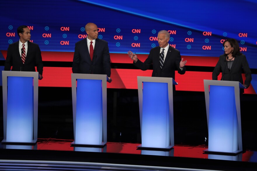 DETROIT, MICHIGAN - JULY 31:  Democratic presidential candidate former Vice President Joe Biden (2nd R) speaks while Sen. Kamala Harris (D-CA) (R) and Sen. Cory Booker (D-NJ) and former housing secretary Julian Castro listen during the Democratic Presidential Debate at the Fox Theatre July 31, 2019 in Detroit, Michigan.  20 Democratic presidential candidates were split into two groups of 10 to take part in the debate sponsored by CNN held over two nights at Detroit’s Fox Theatre.  (Photo by Scott Olson/Getty Images)