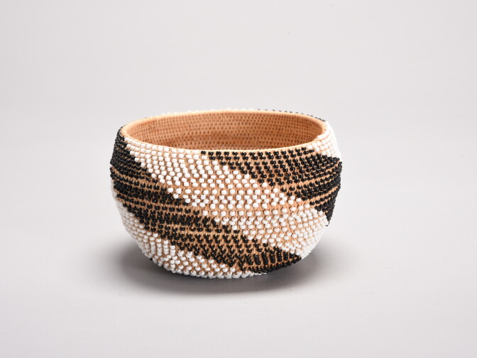 Beaded coiled basket by Mabel McKay on display at the exhibition.
