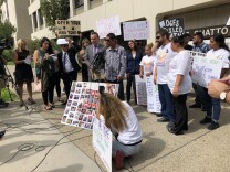 Activists stand in support as the family of 10-year-old Anthony Avalos accuses DCFS of negligence in protecting him.