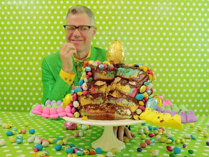 Charles Phoenix poses with his Tequila-Soaked Peep-Stuffed Broken Bunny Cake.