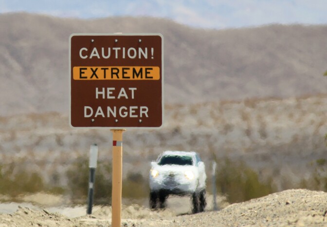 Heat waves rise near a heat danger warning sign on the eve of the AdventurCORPS Badwater 135 ultra-marathon race on July 14, 2013 in Death Valley National Park, California. Billed as the toughest footrace in the world, the 36th annual Badwater 135 starts at Badwater Basin in Death Valley, 280 feet below sea level, where athletes begin a 135-mile non-stop run over three mountain ranges in extreme mid-summer desert heat to finish at 8,350-foot near Mount Whitney for a total cumulative vertical ascent of 13,000 feet. July 10 marked the 100-year anniversary of the all-time hottest world record temperature of 134 degrees, set in Death Valley where the average high in July is 116. 