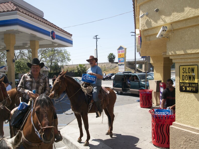 After stocking up on supplies, they riders get ready to hit the trail again.
