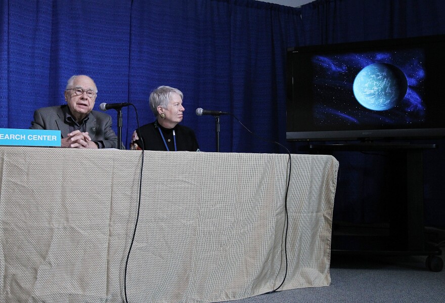 MOFFETT FIELD, CA - DECEMBER 05:  Bill Borucki, (L) Kepler Principal Investigator at NASA Ames Research Center and Jill Tarter, director of the Center for SETI Research look at a graphic showing the newly discovered planet Kepler-22b during a news conference at the NASA Ames Research Center on December 5, 2011 in Moffett Field, California.  Scientsts with NASA's Kepler mission announced that they discoverd a planet in the "habitable zone" where water could exist on the planet's surface. The newly confirmed planet is being called Kepler-22b and is approximately 2.4 times the radius of earth and orbits a star similar to the earth's sun.  (Photo by Justin Sullivan/Getty Images)