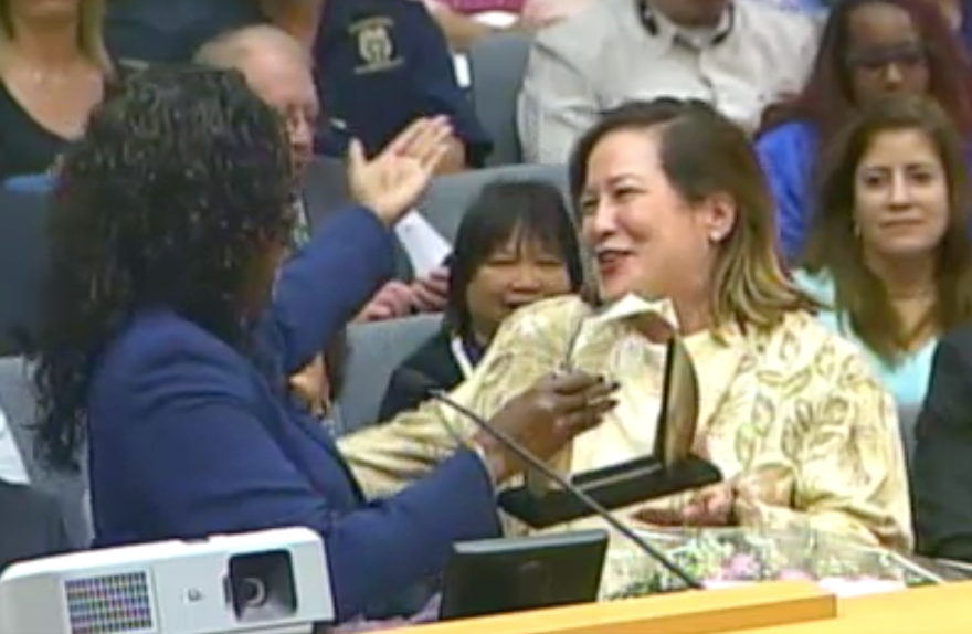 Megan Reilly, then the L.A. Unified School District's Chief Financial Officer, embraces former LAUSD Superintendent Michelle King during a board meeting on March 14, 2017.