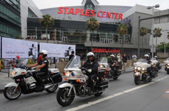 LAPD police patrol around the Staples Center before the memorial service for musical legend Michael Jackson in Los Angeles on July 7, 2009.