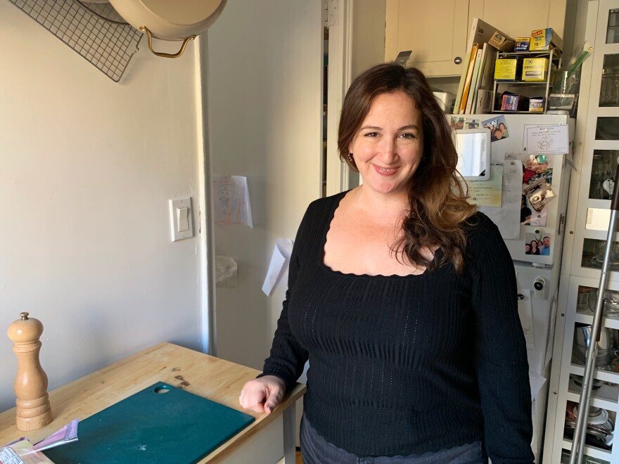 Deb Perelman in her small "smitten" kitchen in New York City's East Village. "I make it work!" she says. "I like that there's a lot of light coming in."