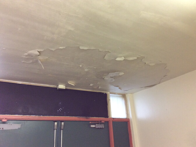 An inspector's photo shows the damaged ceiling in the boys' locker room at Inglewood High School.