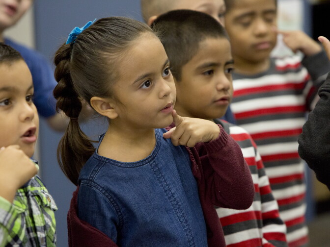 Lily De Dios sings in Mr. Morris' kindergarten dual immersion class at Stone Avenue Elementary School in California's Jurupa Valley on Friday, November 4th, 2016.