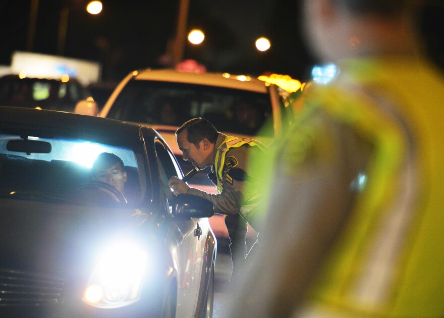 Los Angeles County Sheriff's Department deputies conduct a DUI checkpoint in Bellflower on March 6, 2014, near the intersection of Woodruff Avenue and Alondra Boulevard. Deputies asked passing motorists to show their driver's licenses and also asked drivers if they had consumed alcoholic beverages or taken drugs before driving.
