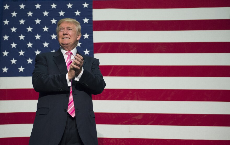 Republican presidential nominee Donald Trump takes the stage for a campaign event at Fredericksburg Expo Center in Fredericksburg, Virginia. 