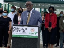 L.A. City Councilmember Curren Price stands at a podium as he speaks to press to announce a motion that would set up a $5 million relief fund for families affected by the June 30 botched LAPD detonation. 