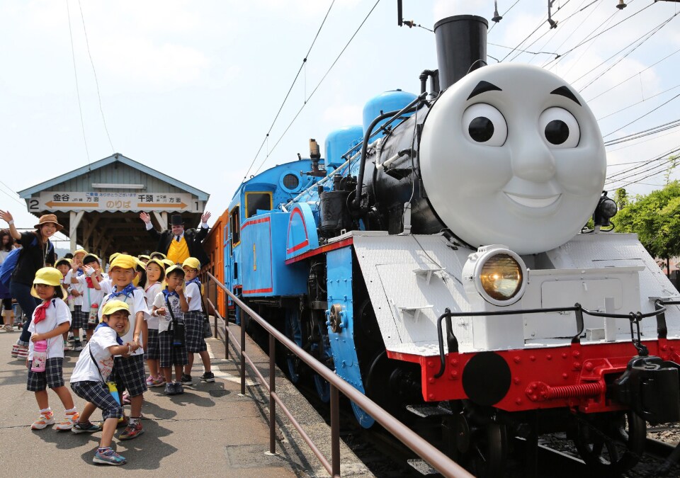 A life-sized Thomas the Tank Engine is surrounded by schoolchildren at Shinkanaya station along Japan's Oigawa railway, in the city of Shimada, west of Tokyo.