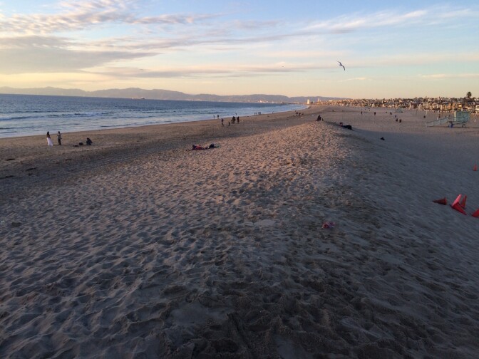 A sand burm near the Hermosa Beach pier, part of measures the city is putting in place to respond to potential flooding and storm surges.