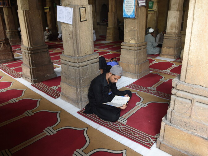 Indian Muslims read inside the Pir Kamal Danilimda Masjid ahead of the Muslim festival of Eid al-Fitr in Ahmedabad on June 24, 2017.
Eid al-Fitr is the biggest festive Muslim event and marks the end of the holy fasting month of Ramadan. / AFP PHOTO / SAM PANTHAKY        (Photo credit should read SAM PANTHAKY/AFP/Getty Images)