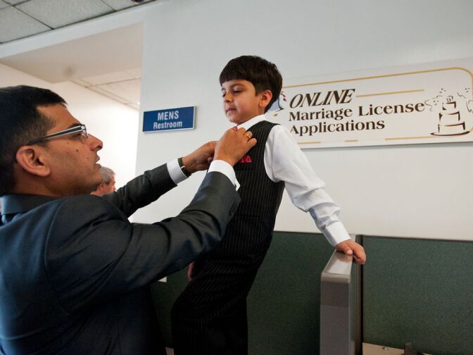 Family members get ready for a wedding in the lobby. Dozens of couples get married in the small chapel in Norwalk at the LA County Registrar-Recorder’s office.