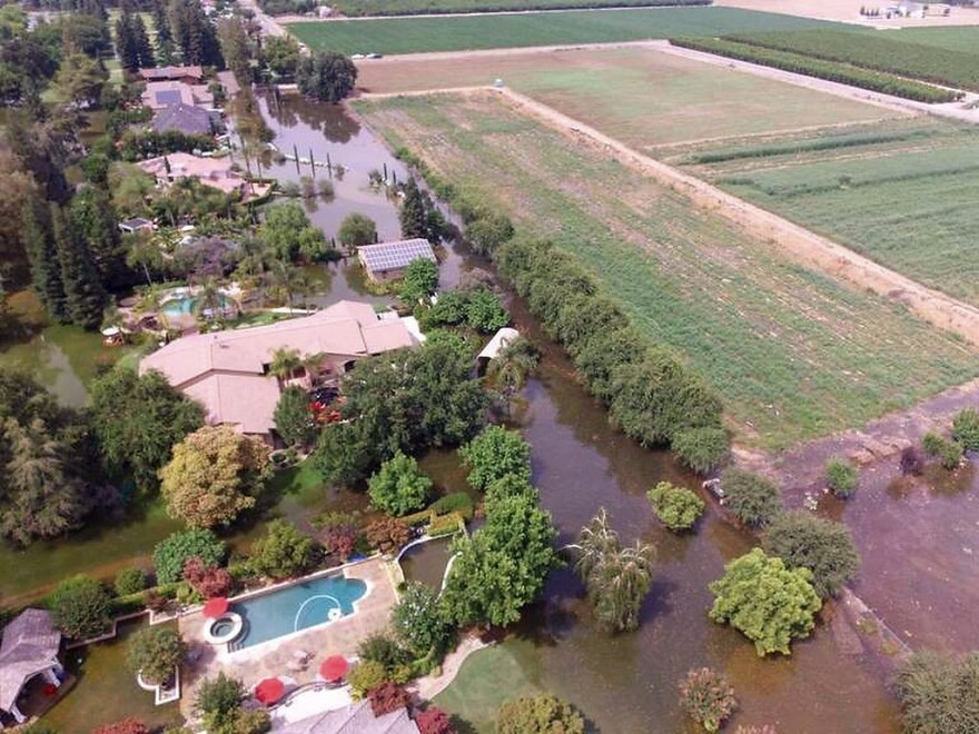 This June 25, 2017, photo taken by an unmanned aerial vehicle and released by the Tulare County Sheriff's Office shows flooding from the Kings River at the Kings River Golf and Country Club in Kingsburg, Calif. The Kings River began to flood about 25 miles (40 kilometers) north of Fresno as temperatures soared, melting snow in the Sierra Nevada and sending it downstream.