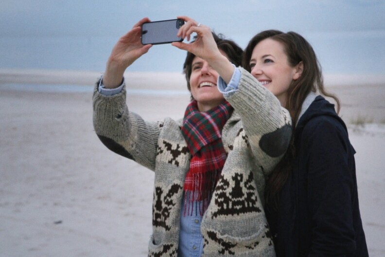 Tig Notaro and her girlfriend, Stephane Allynne, pose for a selfie in the documentary, "Tig."