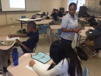 Principal Carla McCullough teaches the College Readiness class in her charter school's one-week 9th grade summer bridge program.