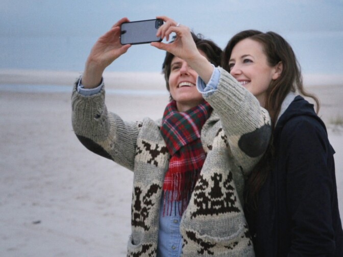 Tig Notaro and her girlfriend, Stephane Allynne, pose for a selfie in the documentary, "Tig."