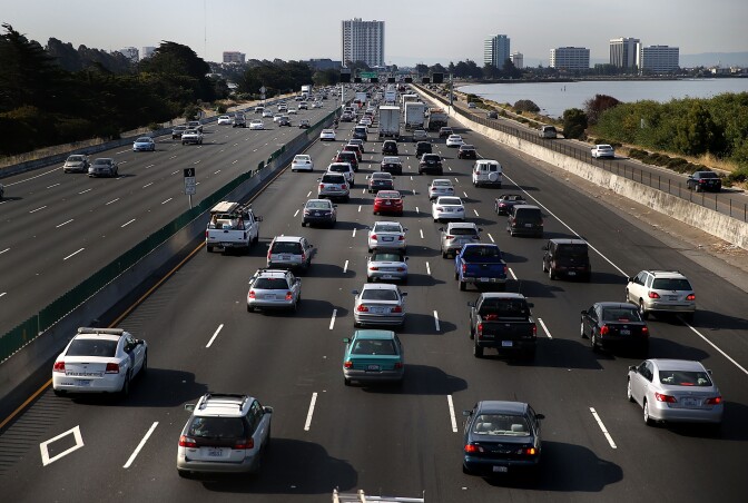 BERKELEY, CA - JULY 01:  Traffic makes its way along Interstate 80 on July 1, 2015 in Berkeley, California. AAA is projecting that nearly 42 million Americans will travel 50 miles or more over the Fourth of July weekend, the largest number since 2007.  (Photo by Justin Sullivan/Getty Images)