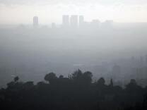A view of downtown Los Angeles,California is seen on a smoggy afternoon, 02 November 2006. Due to the city's geography making it susceptible to atmospheric inversion as well as the heavy reliance on automobiles as a major source of transportation, the city suffers from air pollution in the form of smog. 