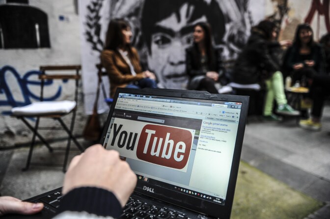 A person uses a laptop computer showing Youtube's logo on March 27, 2014 in Istanbul.