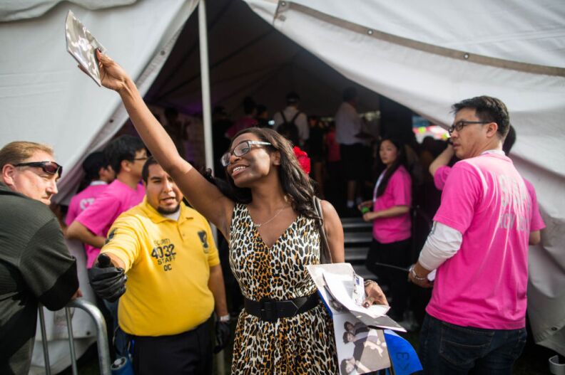 Siobhan Porter, 29, traveled from Miami, Fl., for the KCON convention. She celebrates after scoring a prized autograph from one of her favorite groups.