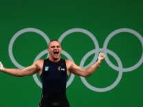 Oleksandr Pielieshenko of Ukraine reacts during the Weightlifting - Men's 85kg on Day 7 of the Rio 2016 Olympic Games at Riocentro - Pavilion 2 on August 12, 2016 in Rio de Janeiro, Brazil.
