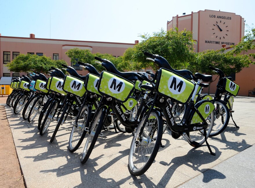 Green and black Metro bikes lined up in a row