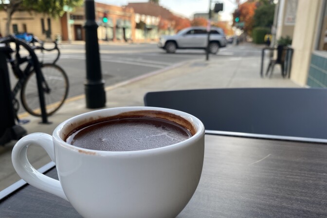A dark hot chocolate sits on a table in Pasadena. 