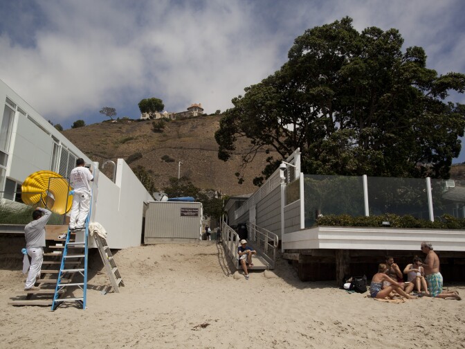 Carbon Beach in Malibu now has a clearly defined public beach access point off the Pacific Coast Highway. But the California Coastal Commission is pursuing homeowners who continue to block public access to the beach next to their property.