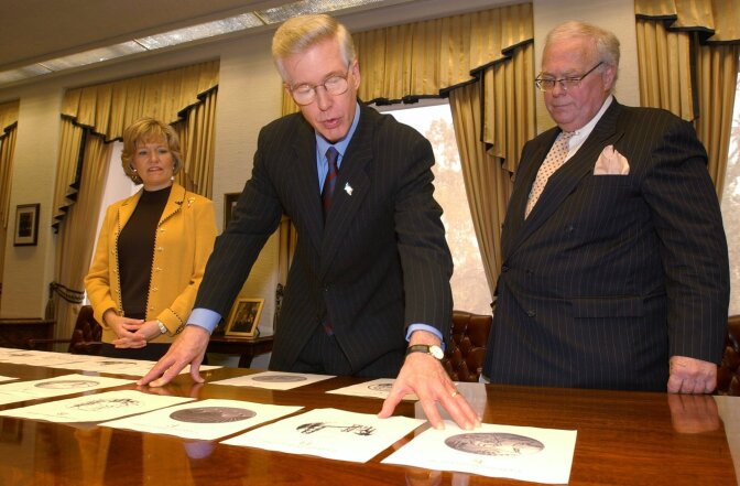 Gov. Gray Davis along with state librarian Kevin Starr, right, and first lady Sharon Davis, left, look over some of the finalists for the design of California's commemorative quarter at the Capitol, Tuesday, March 11, 2003, in Sacramento, Calif. Starr, who was an accomplished scholar and public figure, researched and wrote a series of books considered the definitive account of the California story. He died Saturday at 76.