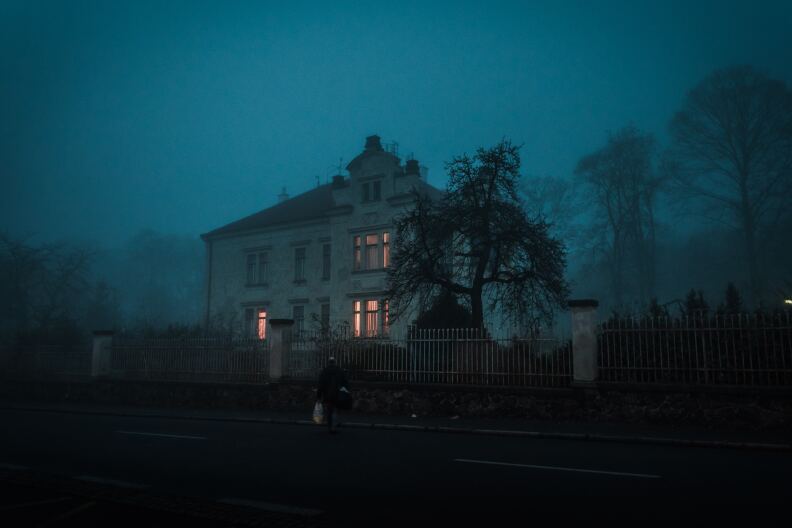 Haunted House with person in front