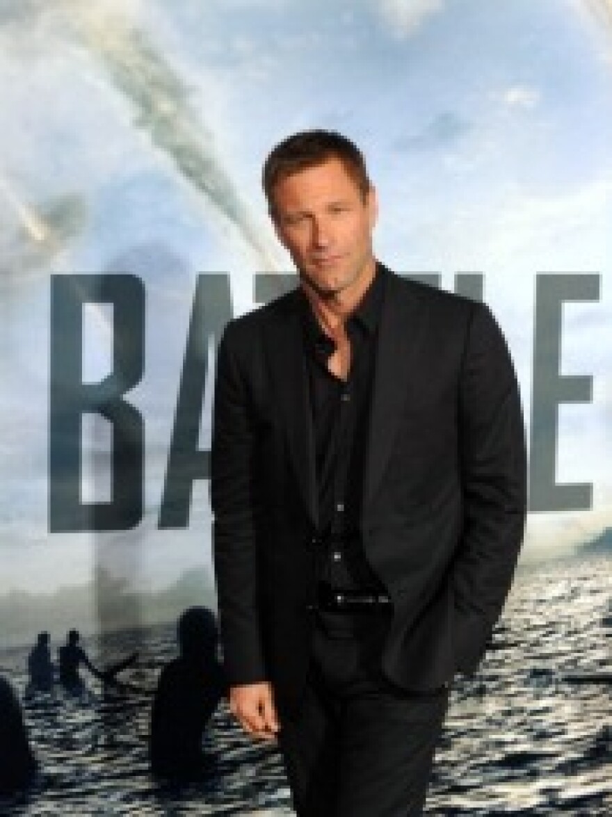 Actor Aaron Eckhart arrives at the premiere of 'Battle : Los Angeles' in Westwood, California on March 8, 2011.