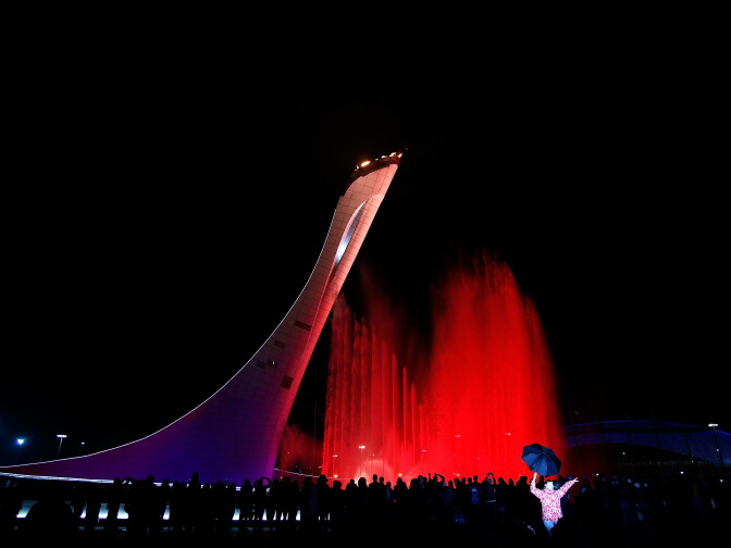 SOCHI, RUSSIA - MARCH 07: A woman is photographed in front of the Olympic caludron following the Opening Ceremony of the Sochi 2014 Paralympic Winter Games at Fisht Olympic Stadium on March 7, 2014 in Sochi, Russia.  (Photo by Harry Engels/Getty Images)