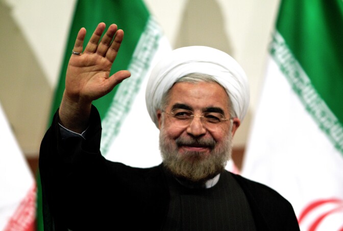 Iranian president-elect Hassan Rowhani waves as he attends a press conference in Tehran on June 17, 2013. Rowhani expressed hope that Iran can reach a new agreement with major powers over its disputed nuclear programme, saying a deal should be reached through more transparency and mutual trust. 