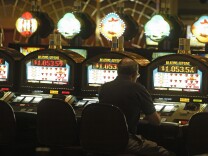 A patron plays a slots machine Friday, Oct. 22, 2004, at the SPA Resort Casino in Palm Springs, Calif. Proposition 70 would remove the 2,000-per-tribe cap on slot machines and also allow tribes to operate Las Vegas-style games currently banned in California, including roulette and craps. In return, casino-owning tribes would give the state 8.84 percent of their net income from both slot machines and table games. Though promoters predicted they would lose at the polls and ended their campaign earlier this month, the initiative will remain on the Nov. 2 ballot. (AP Photo/Damian Dovarganes)
