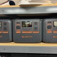 Gray portable backup power batteries on a shelf. 