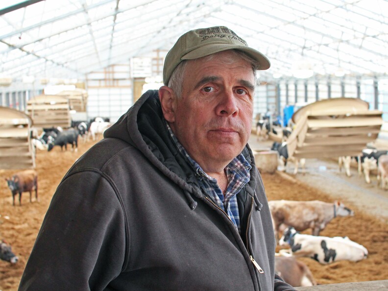 Bill Schuler stands in front of his cows on his <a href="http://www.shulerdairyfarms.com/">farm</a> in southwest Michigan.