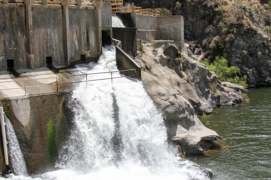 Water flows down a dam spillway into the San Gabriel River