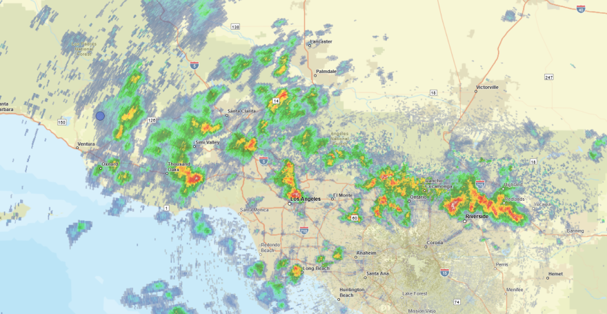 Map shows weather across Southern California, with green, yellow and orange areas denoting rain and thunder.