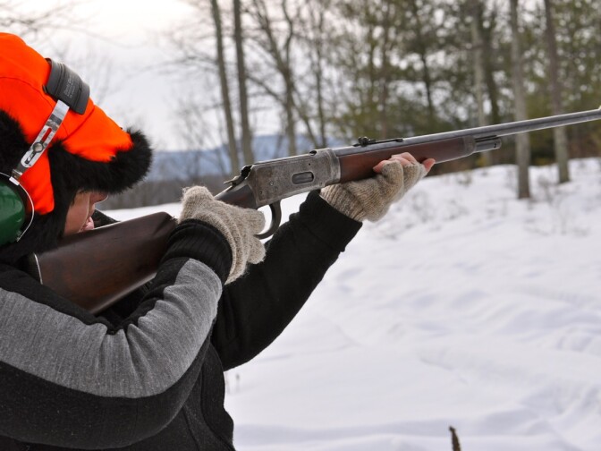 Nao Bustamante, "Tierra y Libertad, Kevlar® 2945", 2011, production still. “Test Shoot,” Bustamante uses a gun typical of the Mexican Revolution to test the protective strength of her fighting costume. 