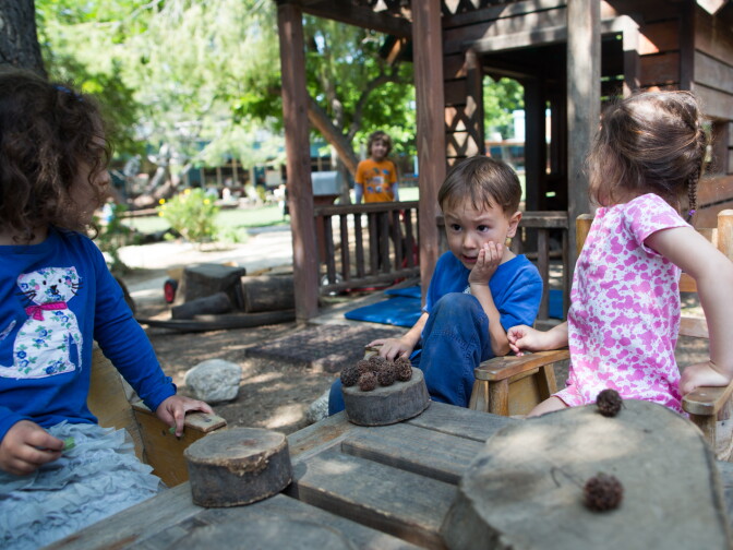 Preschool students pretend to have a tea party at the Child Educational Center in La Cañada.