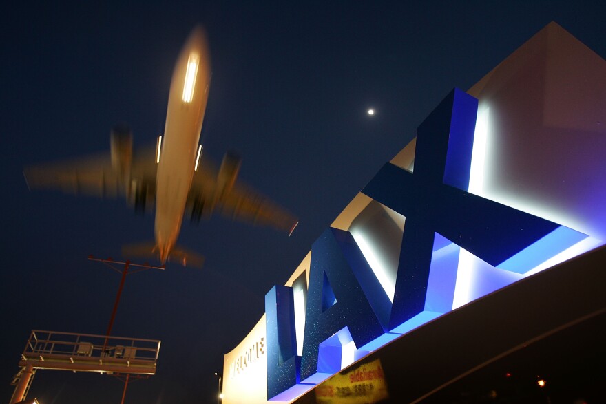 A jet comes in for landing at Los Angeles International Airport (LAX) in Los Angeles, California. 