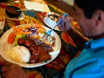 Masero Lopez eats lunch at Guelaguetza on Thursday. The restaurant is known for its mole and Mezcal selection.