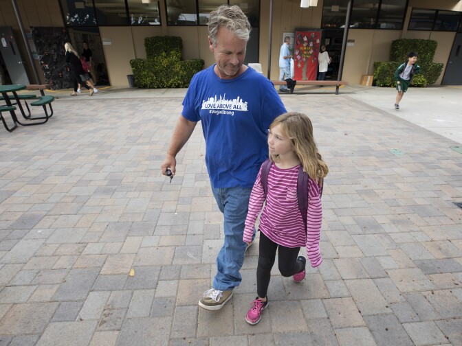 Bob Patterson picks up his daughter from school in Lomita, Calif. on Oct. 30, 2017.