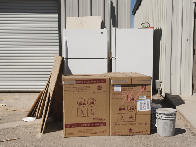 Old appliances and new ones still in their boxes sit in the parking lot of the Quechan Housing Authority on the Fort Yuma Indian Reservation. The Quechan Tribe is using a new tax credit program to fund construction of a 44-unit affordable housing project.  