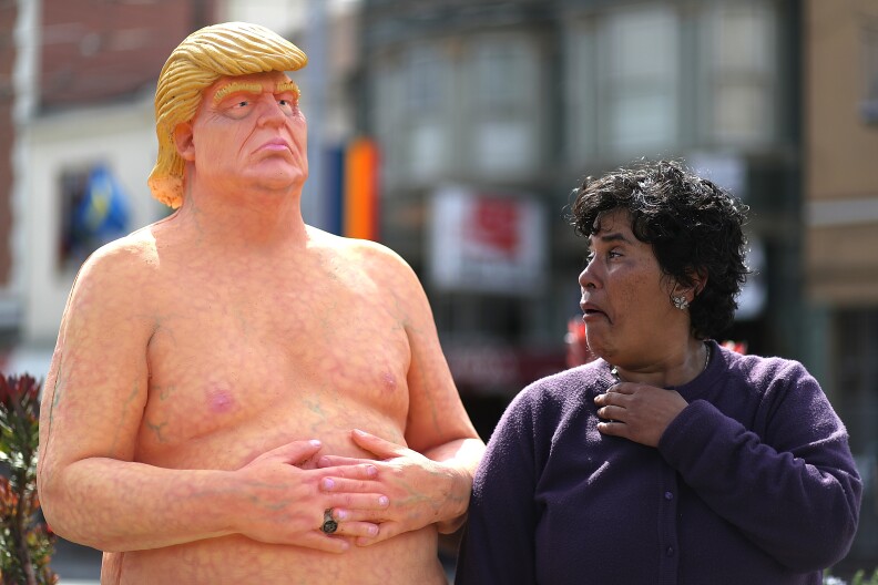 SAN FRANCISCO, CA - AUGUST 18:  A passerby looks at a statue depicting republican presidential nominee Donald Trump in the nude on August 18, 2016 in San Francisco, United States.  Anarchist collective INDECLINE has created five statues depicting Donald Trump in the nude and placed them in five U.S. cities on Thursday morning. The statues are in San Francisco, New York, Los Angeles, Cleveland and Seattle.  (Photo by Justin Sullivan/Getty Images)